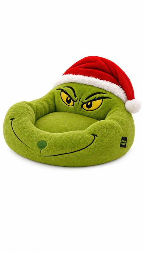 The Grinch Cuddler plush pet bed with a grumpy green face and Santa hat